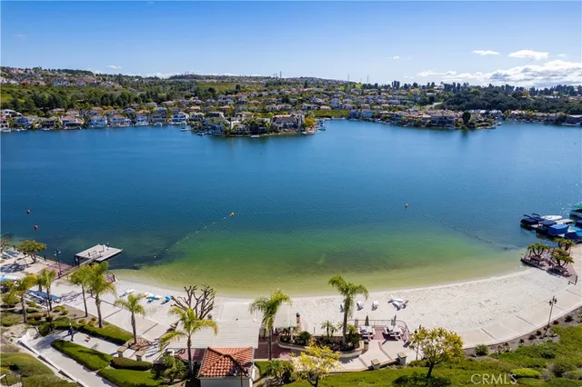 an aerial view of a houses with ocean view