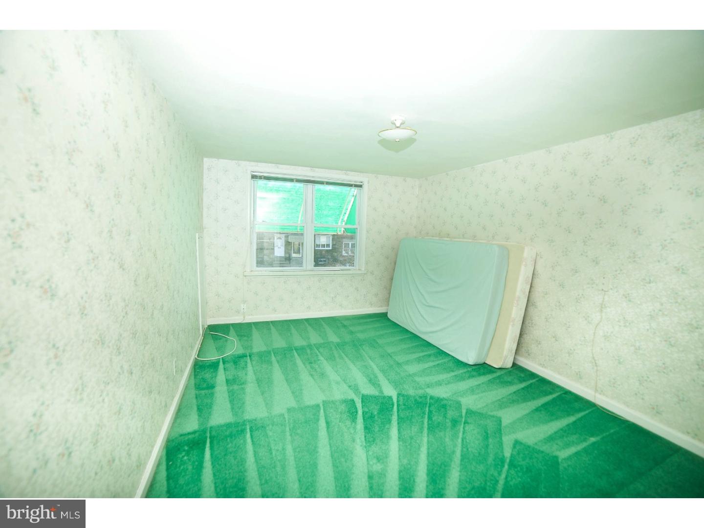 241 Barclay Road Upper Darby, PA 19082 - Photo 6 of 13 a bedroom with a bed and a window