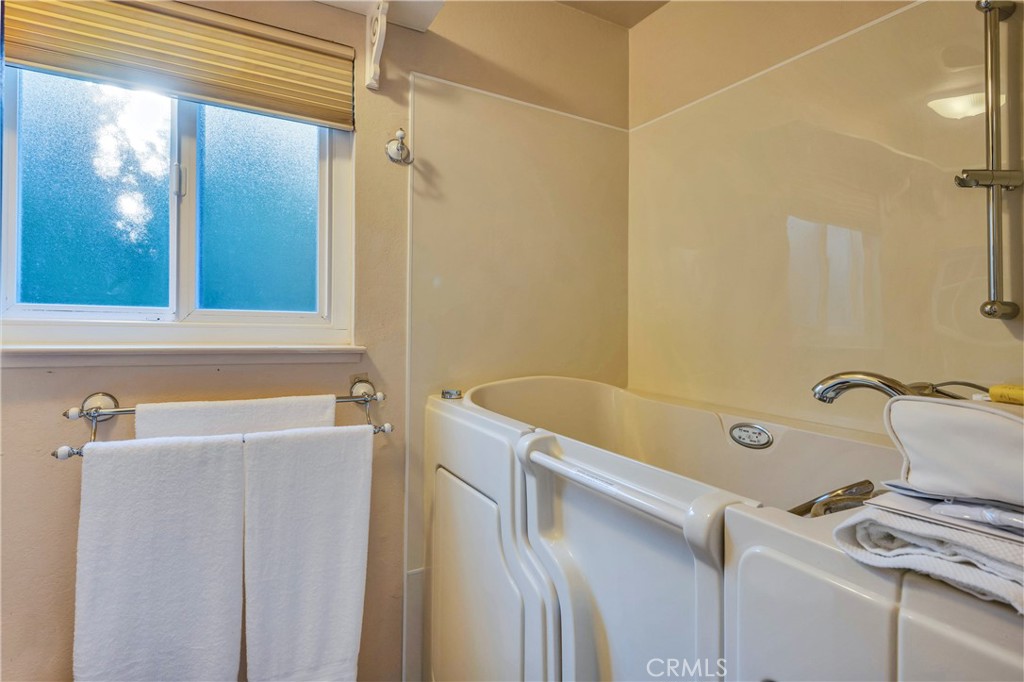 7723 Cora Drive Lucerne, CA 95458 - Photo 19 of 56 a bathroom with a tub sink and mirror
