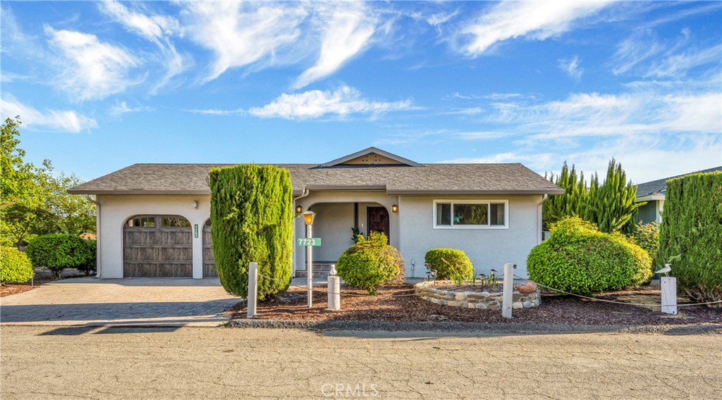 7723 Cora Drive Lucerne, CA 95458 - Photo 25 of 56 a front view of a house with garden