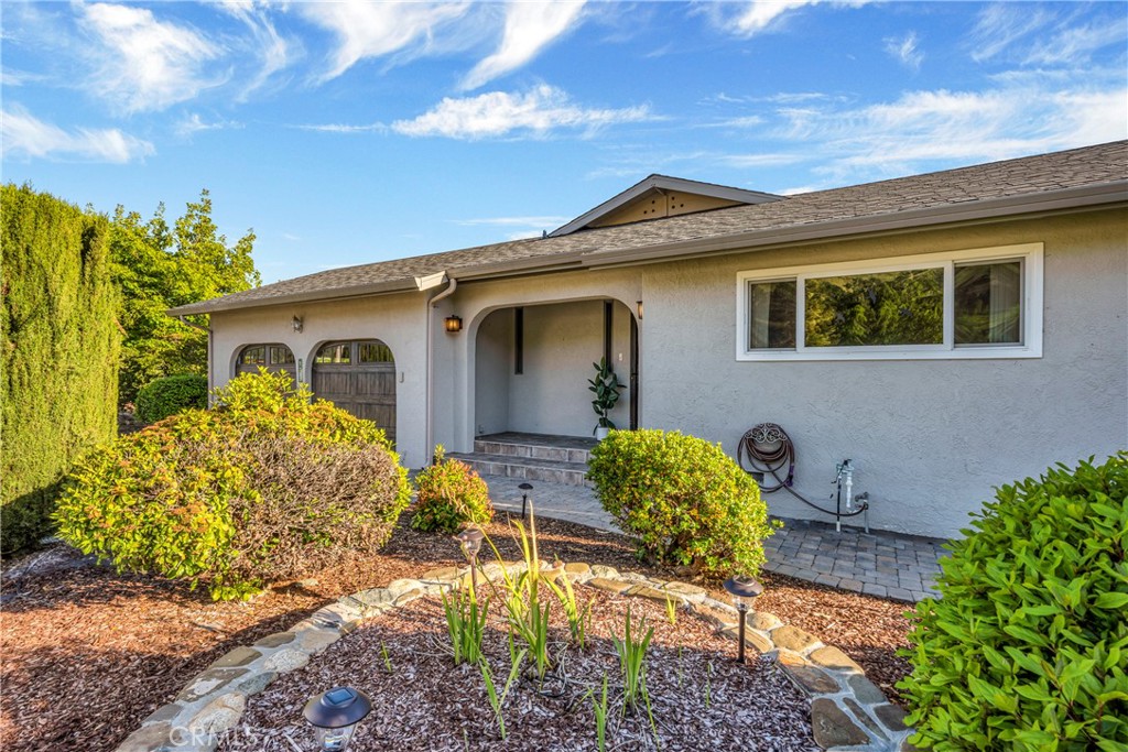 7723 Cora Drive Lucerne, CA 95458 - Photo 26 of 56 a front view of a house with a yard
