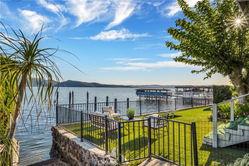 7723 Cora Drive Lucerne, CA 95458 - Photo 3 of 56 a view of a balcony with lake view and a potted plant