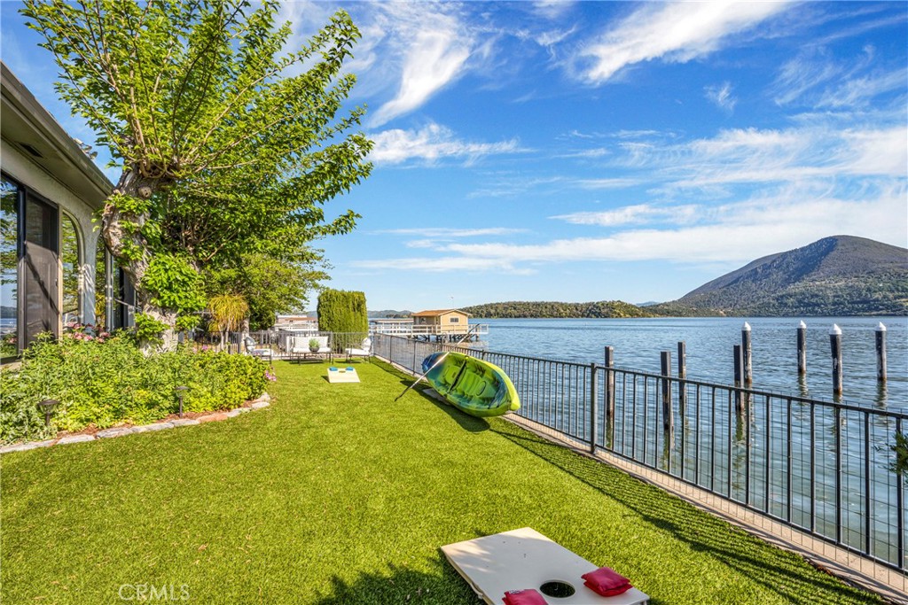 7723 Cora Drive Lucerne, CA 95458 - Photo 31 of 56 a view of a balcony with floor to ceiling windows