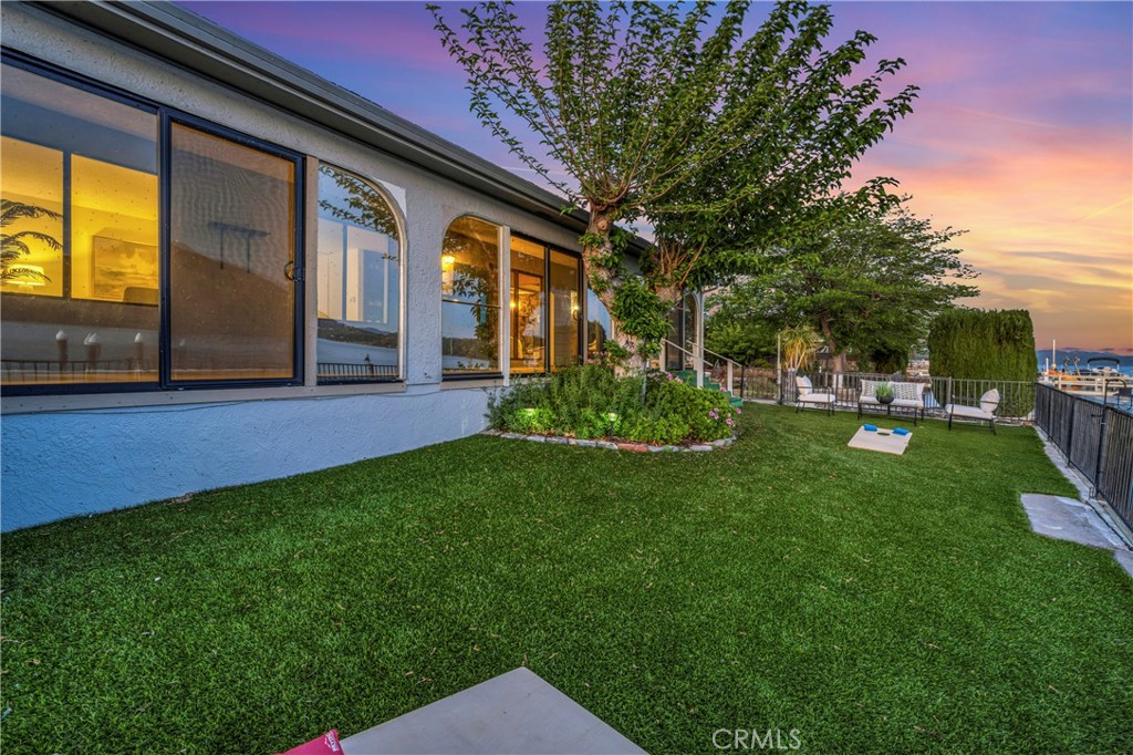 7723 Cora Drive Lucerne, CA 95458 - Photo 40 of 56 a view of a house with a backyard porch and sitting area