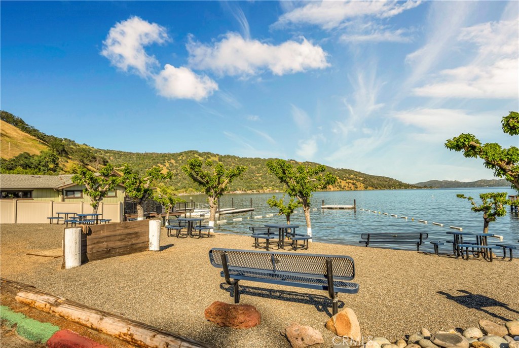 7723 Cora Drive Lucerne, CA 95458 - Photo 47 of 56 a view of a swimming pool with a table and chairs
