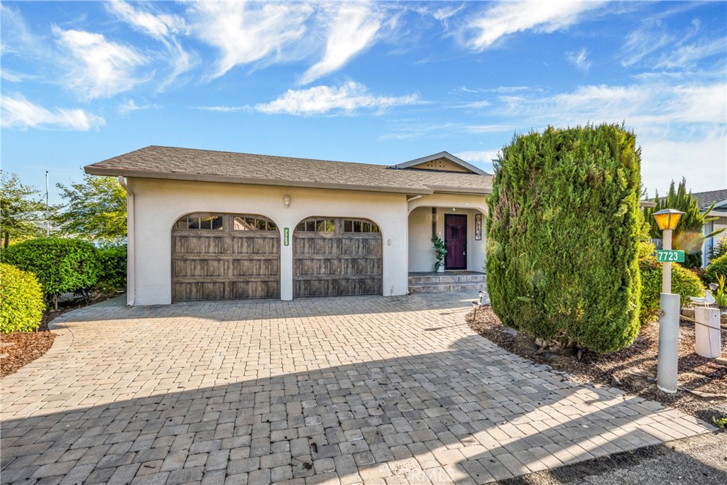 7723 Cora Drive Lucerne, CA 95458 - Photo 5 of 56 a front view of a house with garden
