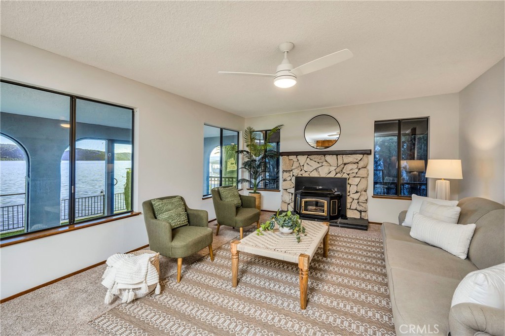 7723 Cora Drive Lucerne, CA 95458 - Photo 6 of 56 a living room with furniture and a fireplace