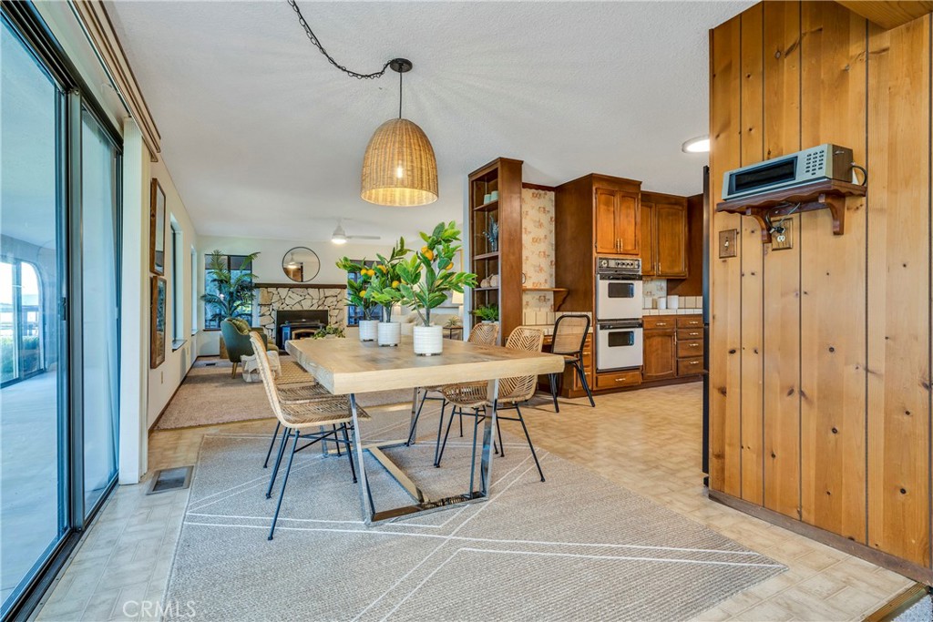 7723 Cora Drive Lucerne, CA 95458 - Photo 8 of 56 a dining room with furniture and a chandelier