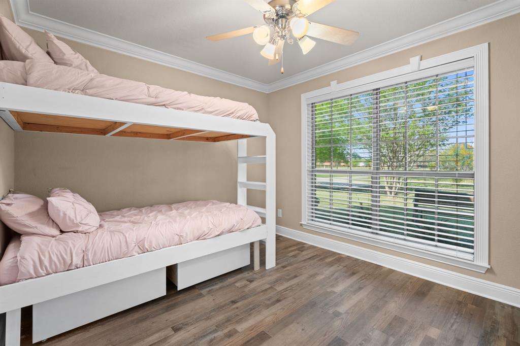 112 Waterfall Court Azle, TX 76020 - Photo 22 of 40 a bedroom with a bed and a window