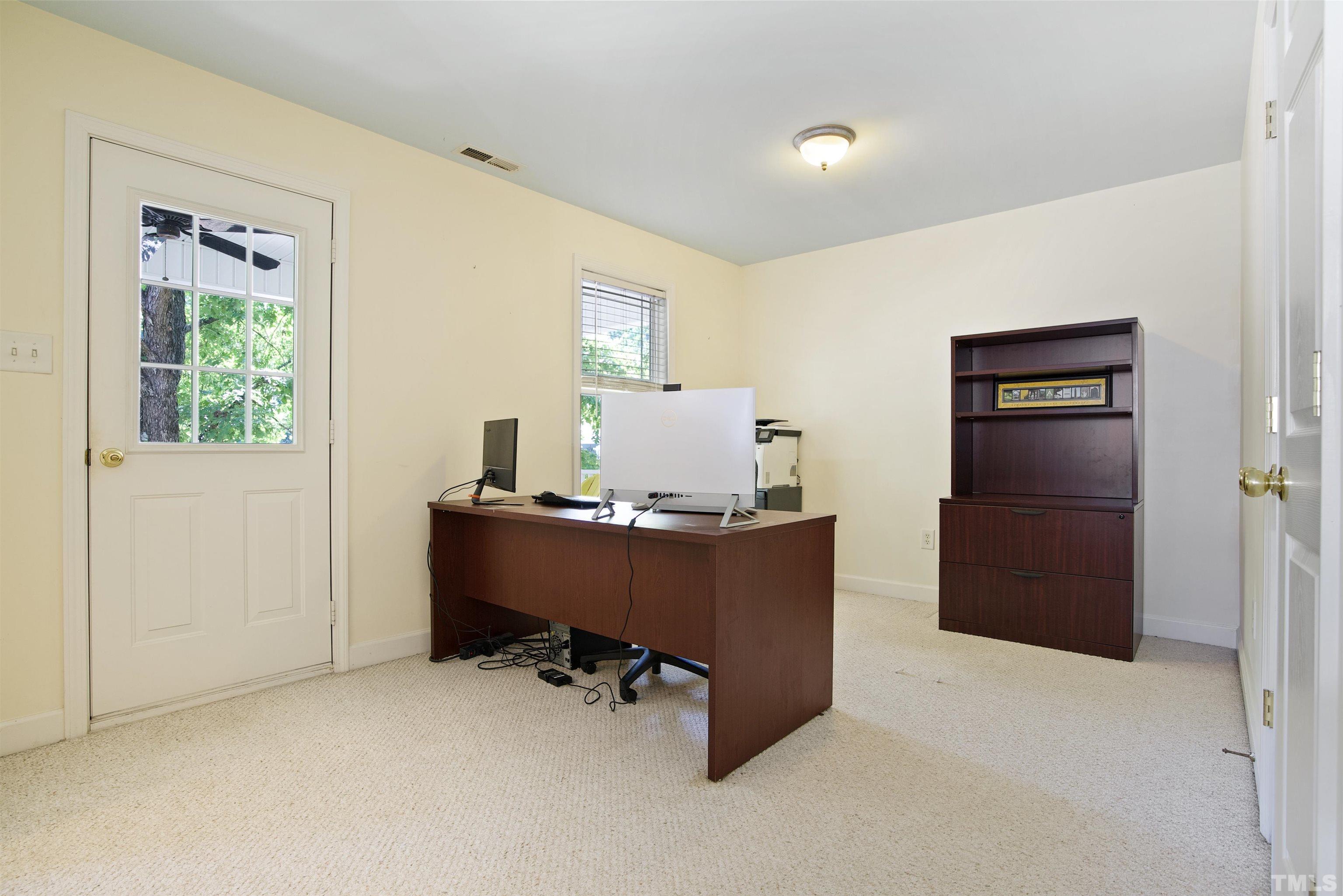 3421 Suncrest Village Lane Raleigh, NC 27616 - Photo 16 of 29 a room with window and furniture