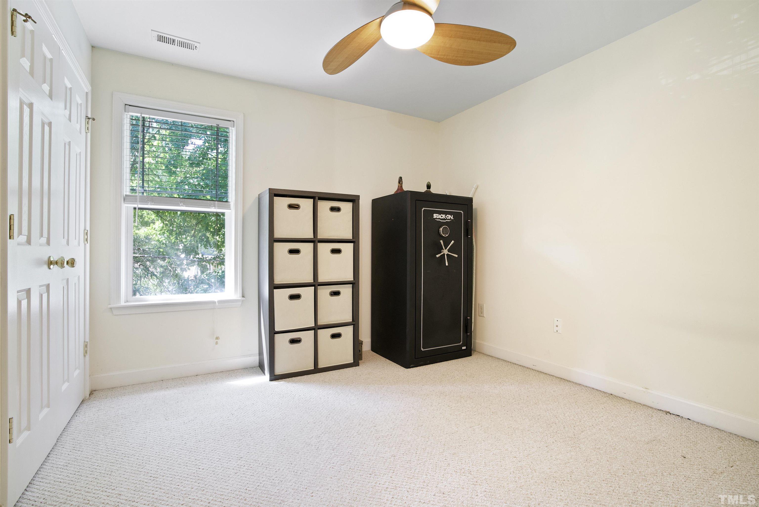 3421 Suncrest Village Lane Raleigh, NC 27616 - Photo 19 of 29 an empty room with windows and closet