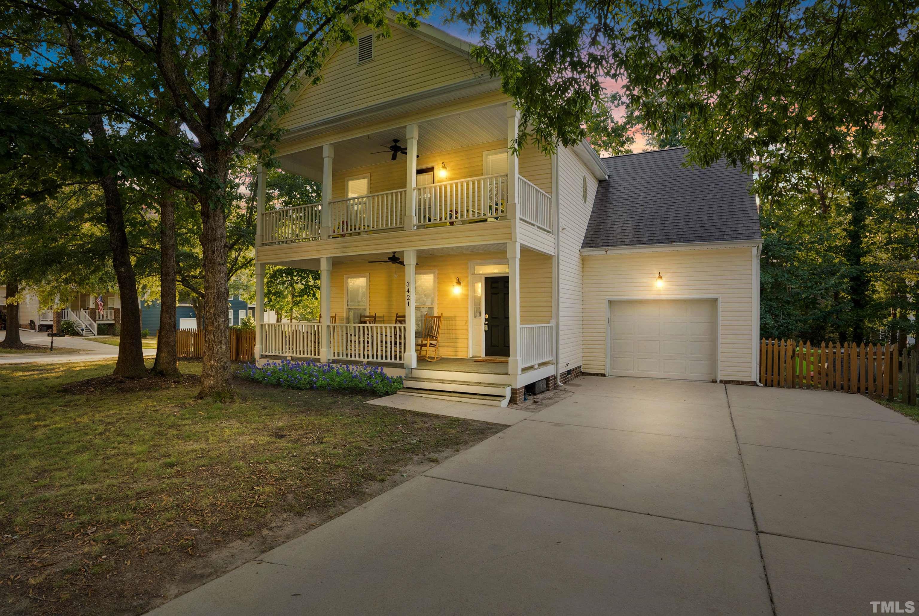 3421 Suncrest Village Lane Raleigh, NC 27616 - Photo 2 of 29 a view of a house with brick walls and a tree