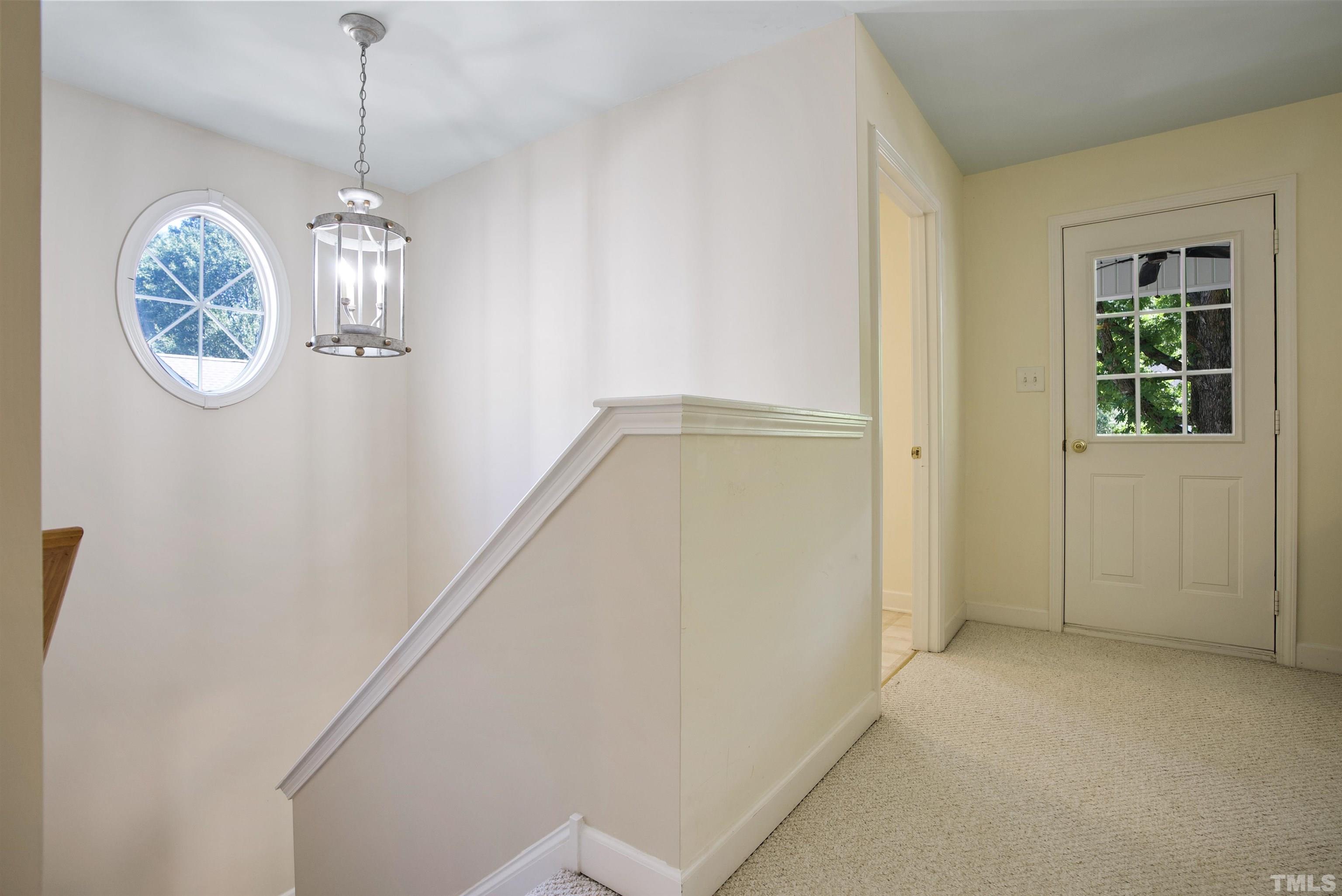 3421 Suncrest Village Lane Raleigh, NC 27616 - Photo 21 of 29 a view of hallway with chandelier