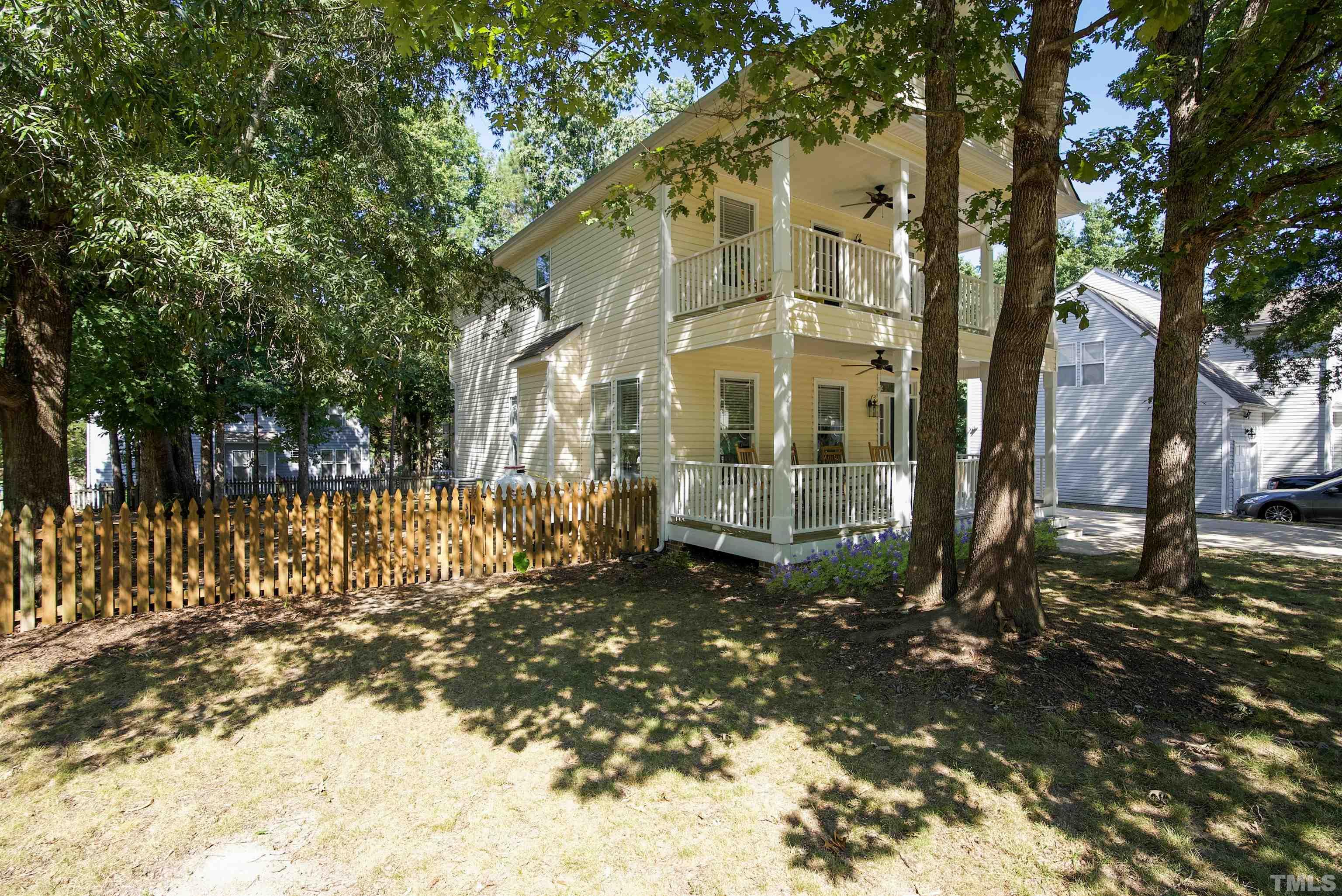 3421 Suncrest Village Lane Raleigh, NC 27616 - Photo 4 of 29 a view of a large yard with plants and trees beside of it