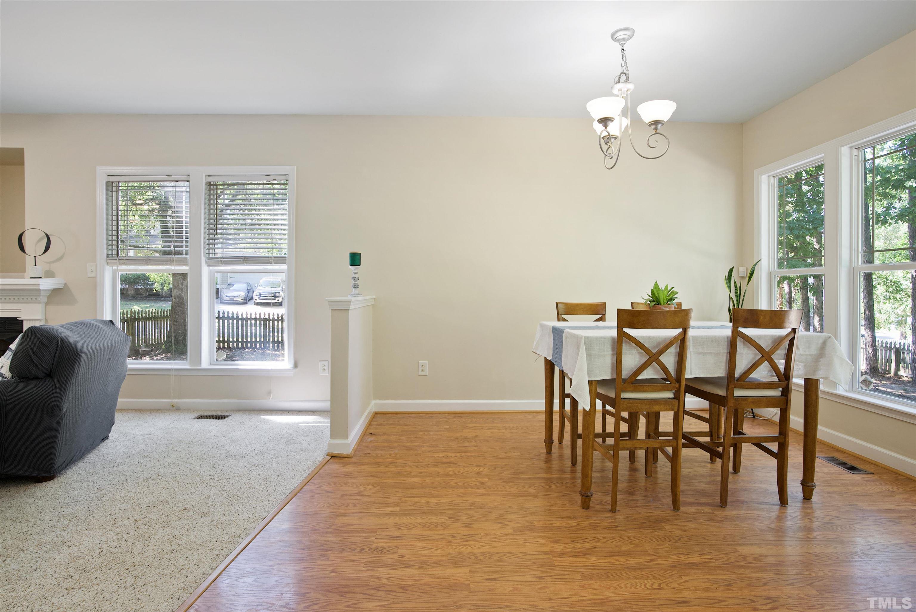 3421 Suncrest Village Lane Raleigh, NC 27616 - Photo 10 of 29 a view of a dining room with furniture window and wooden floor