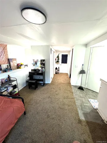 a bed room with a bed and a chair