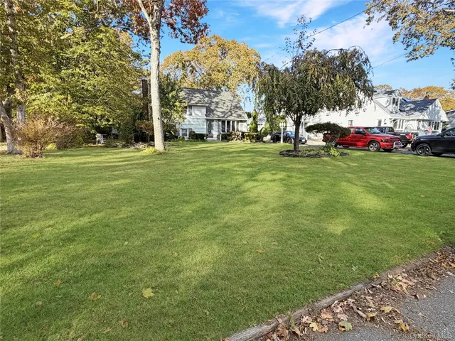 a view of outdoor space with deck and trees