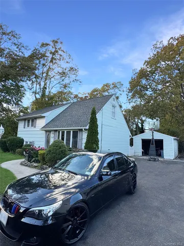 a view of a car parked in front of a house