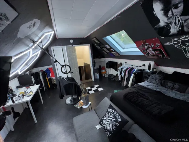 a living room with lots of furniture and clothes