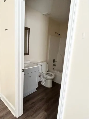 a bathroom with a toilet and a sink