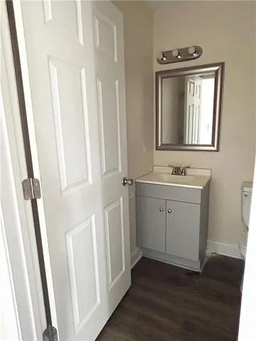 a bathroom with a sink a mirror and a window
