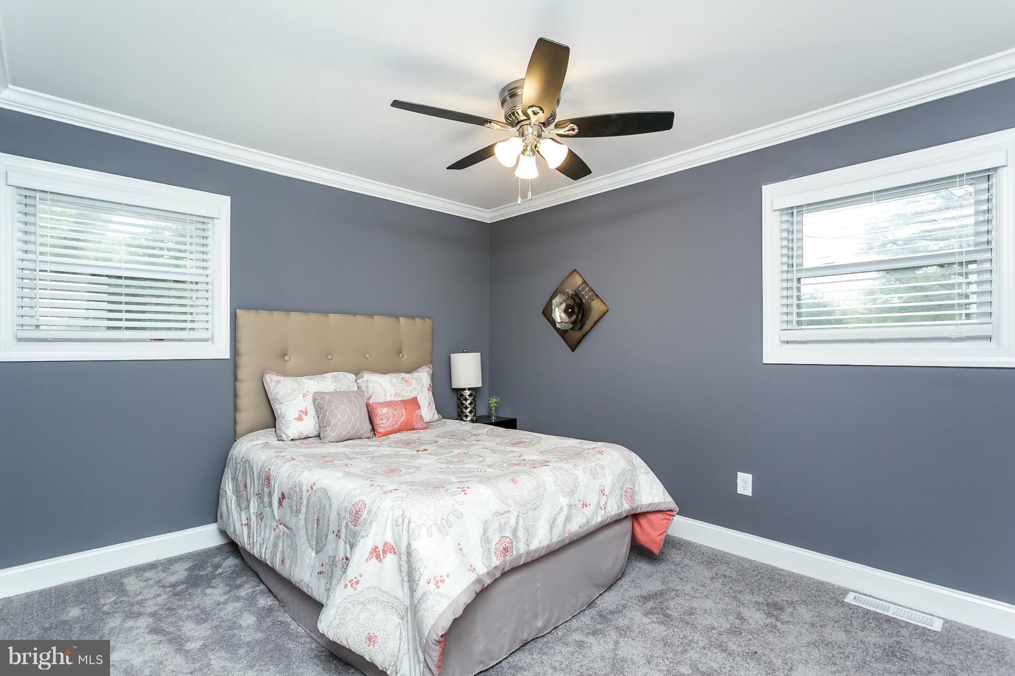 200 Highfalcon Road Reisterstown, MD 21136 - Photo 14 of 28 a bedroom with a large bed and a window