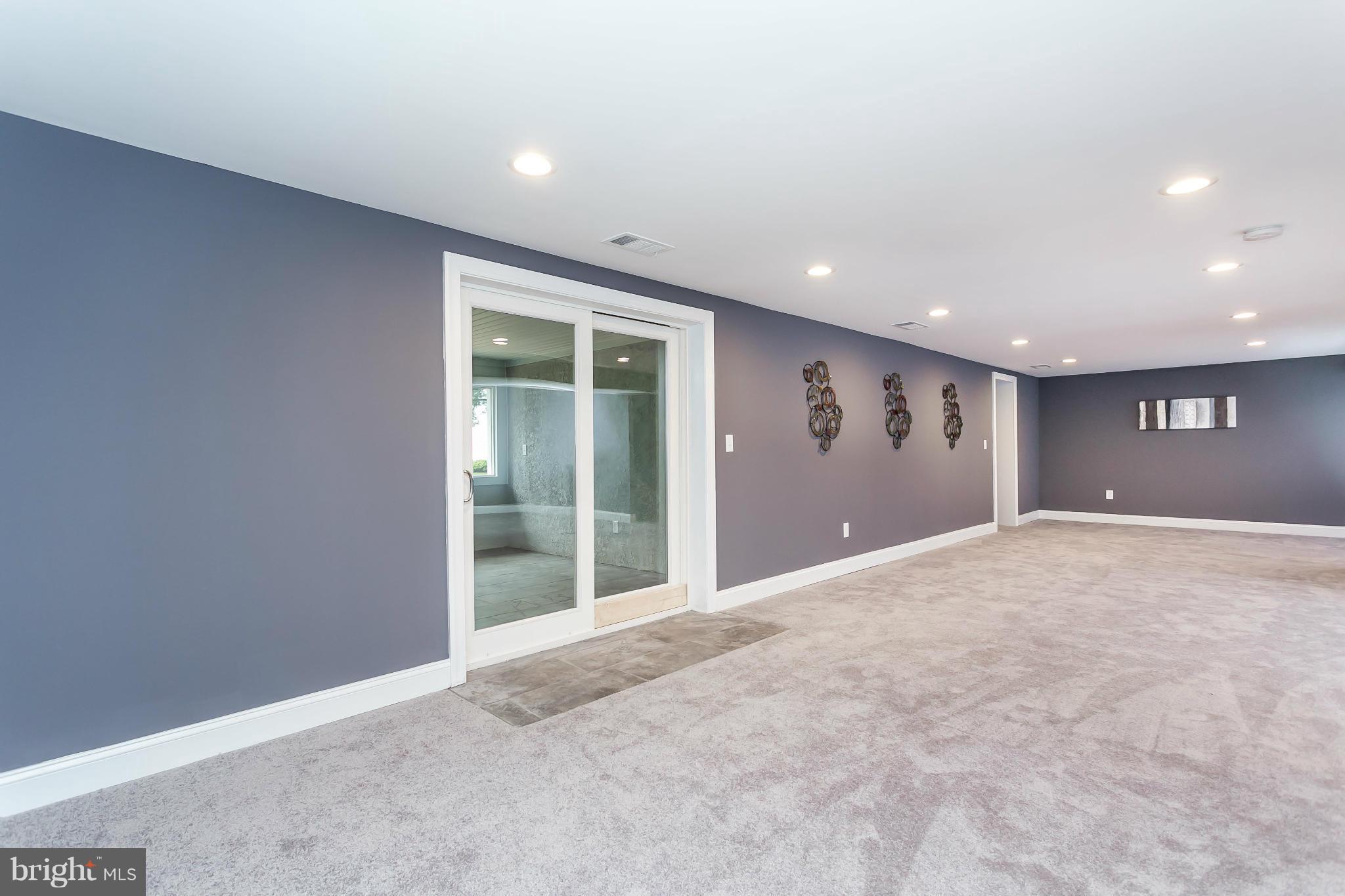 200 Highfalcon Road Reisterstown, MD 21136 - Photo 19 of 28 a view of an empty room with wooden floor and a window