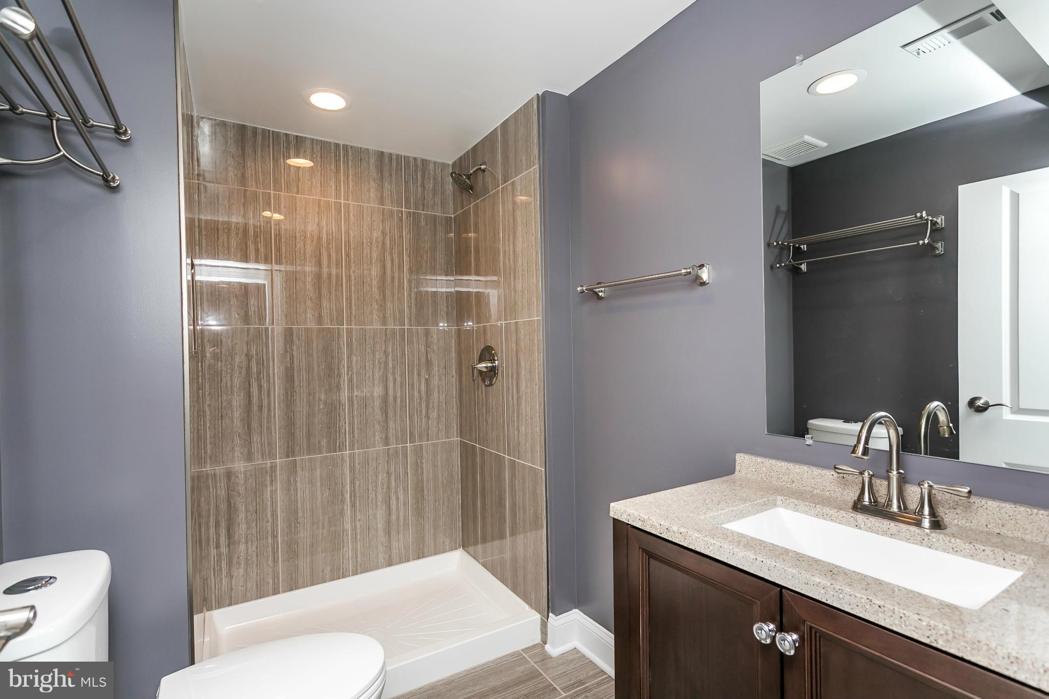 200 Highfalcon Road Reisterstown, MD 21136 - Photo 21 of 28 a bathroom with a sink toilet and shower