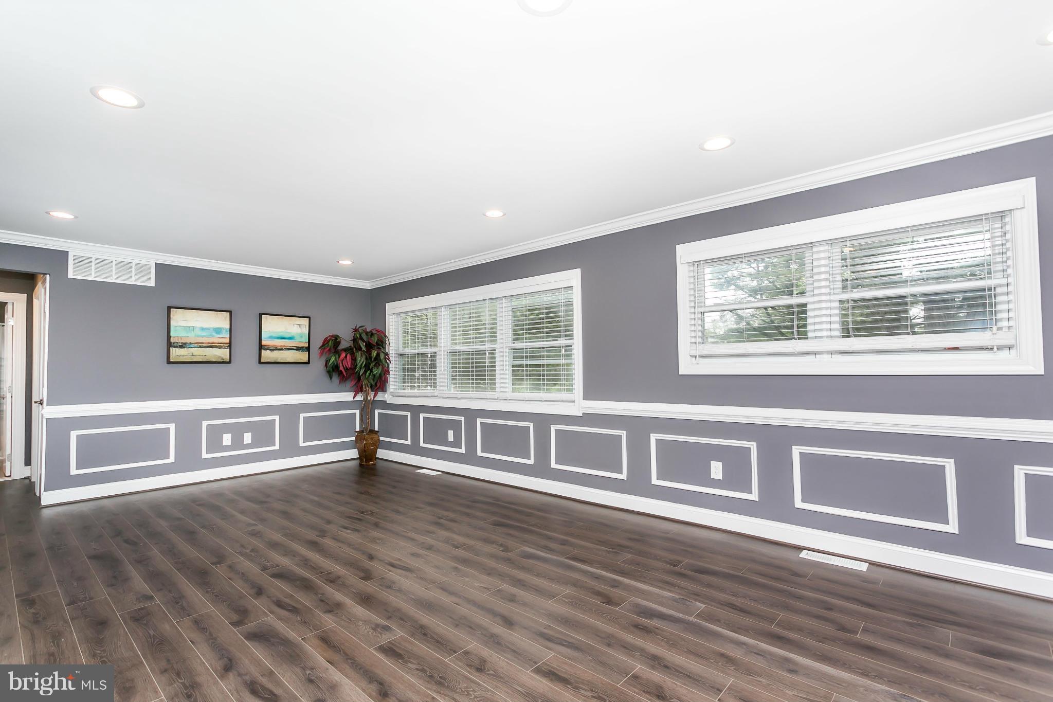 200 Highfalcon Road Reisterstown, MD 21136 - Photo 4 of 28 a view of an empty room with window and wooden floor