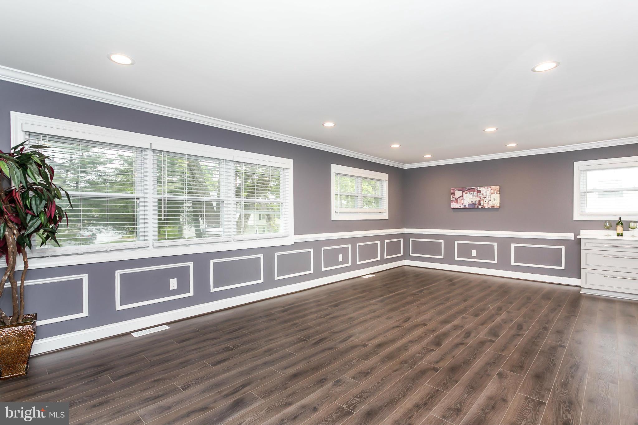 200 Highfalcon Road Reisterstown, MD 21136 - Photo 7 of 28 a view of an empty room with wooden floor and a window
