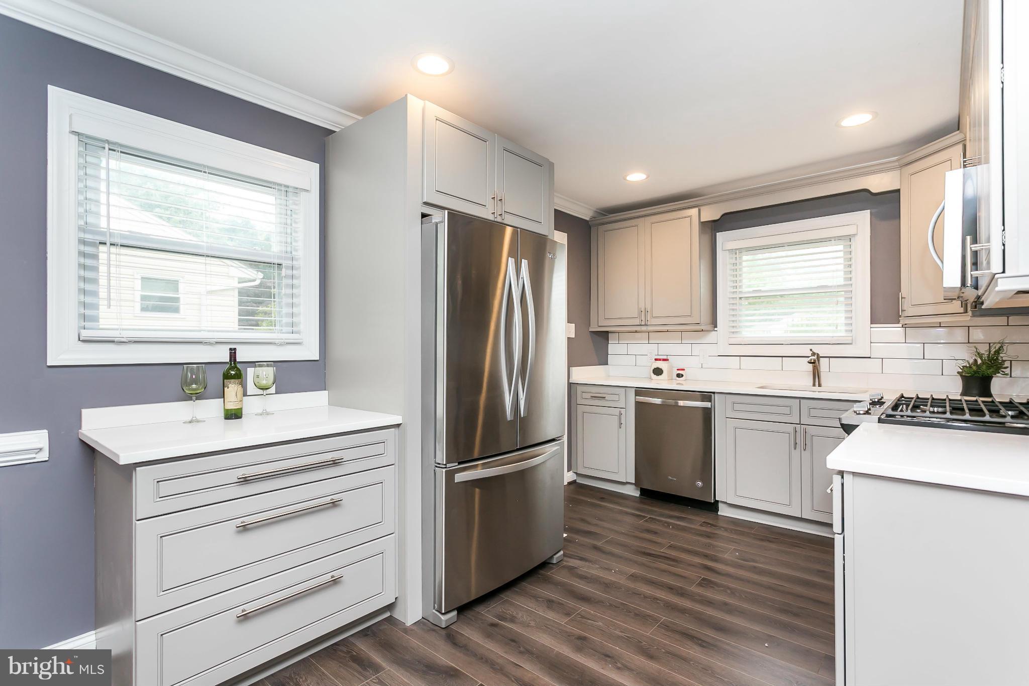 200 Highfalcon Road Reisterstown, MD 21136 - Photo 8 of 28 a kitchen with a refrigerator stove and sink