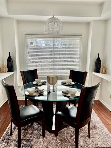 a living room with furniture and a baby crib