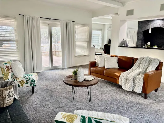 a view of a backyard with sitting area