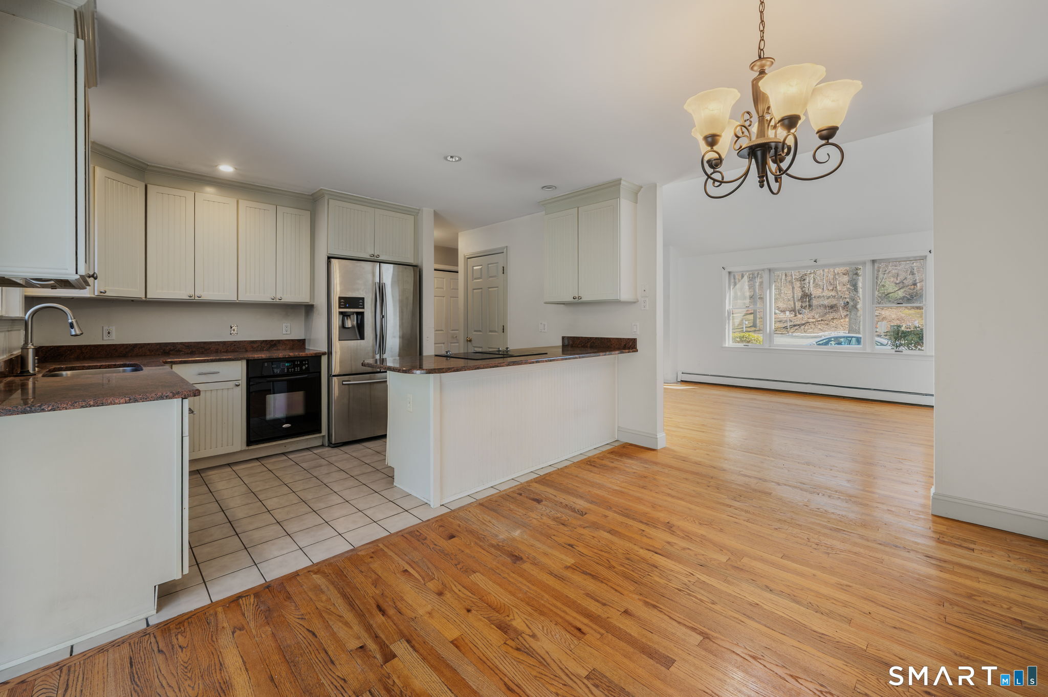 5 Windy Ridge Place, Unit 5 Waterford, CT 06385 - Photo 11 of 37 a kitchen with stainless steel appliances granite countertop a refrigerator and a stove top oven