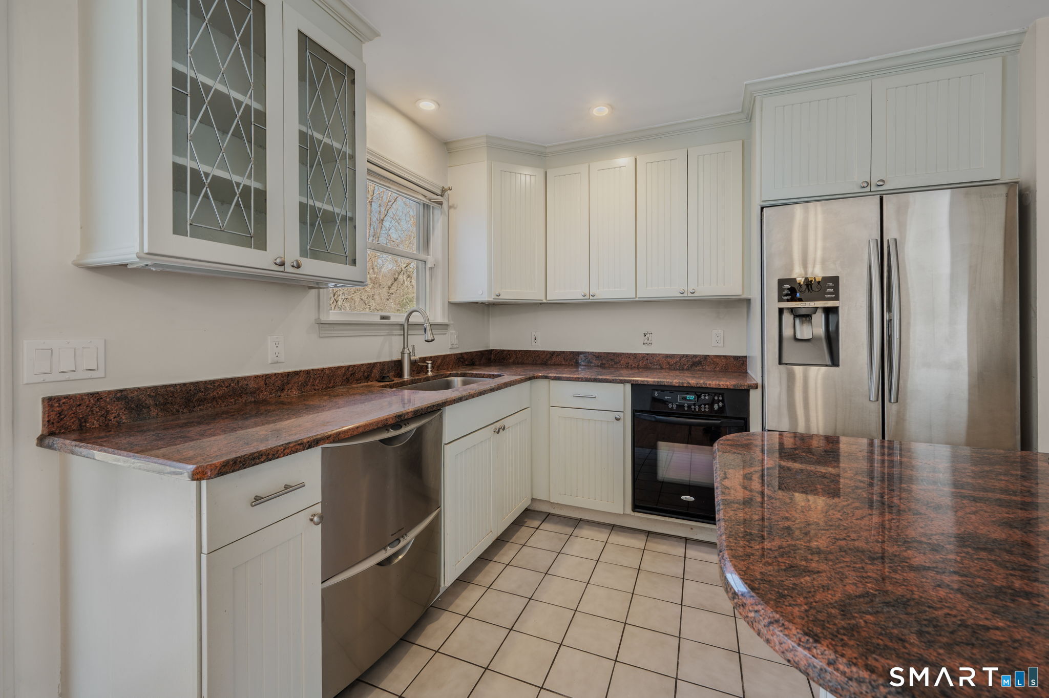 5 Windy Ridge Place, Unit 5 Waterford, CT 06385 - Photo 14 of 37 a kitchen with stainless steel appliances granite countertop a stove a refrigerator and a sink