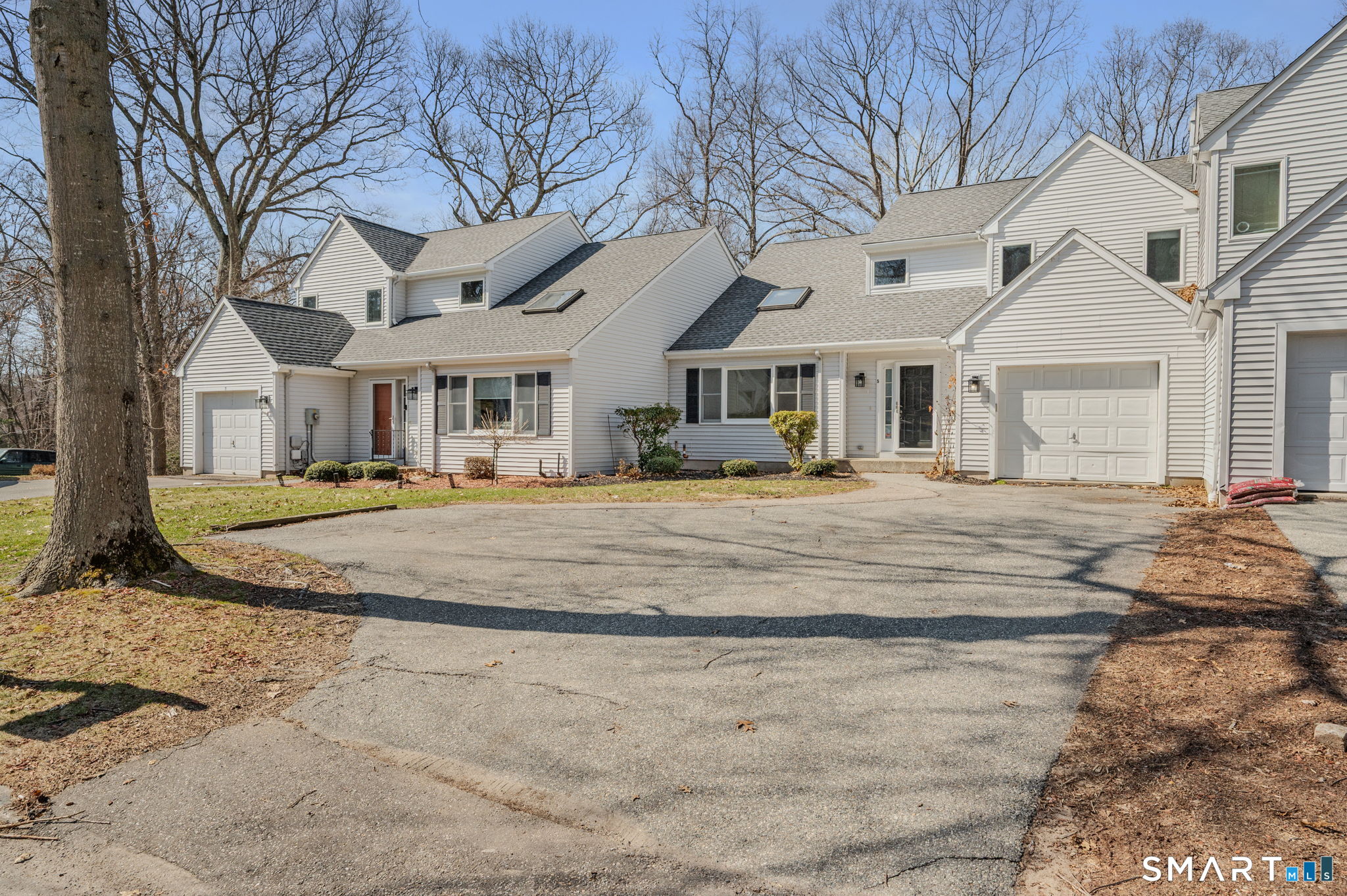 5 Windy Ridge Place, Unit 5 Waterford, CT 06385 - Photo 2 of 37 a front view of a house with a yard