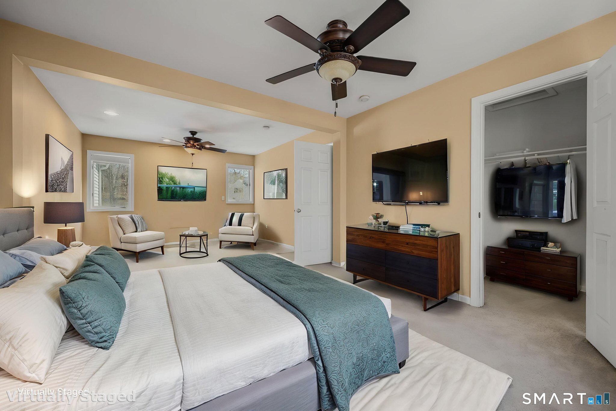 5 Windy Ridge Place, Unit 5 Waterford, CT 06385 - Photo 26 of 37 a bedroom with a bed a couch and a flat screen tv