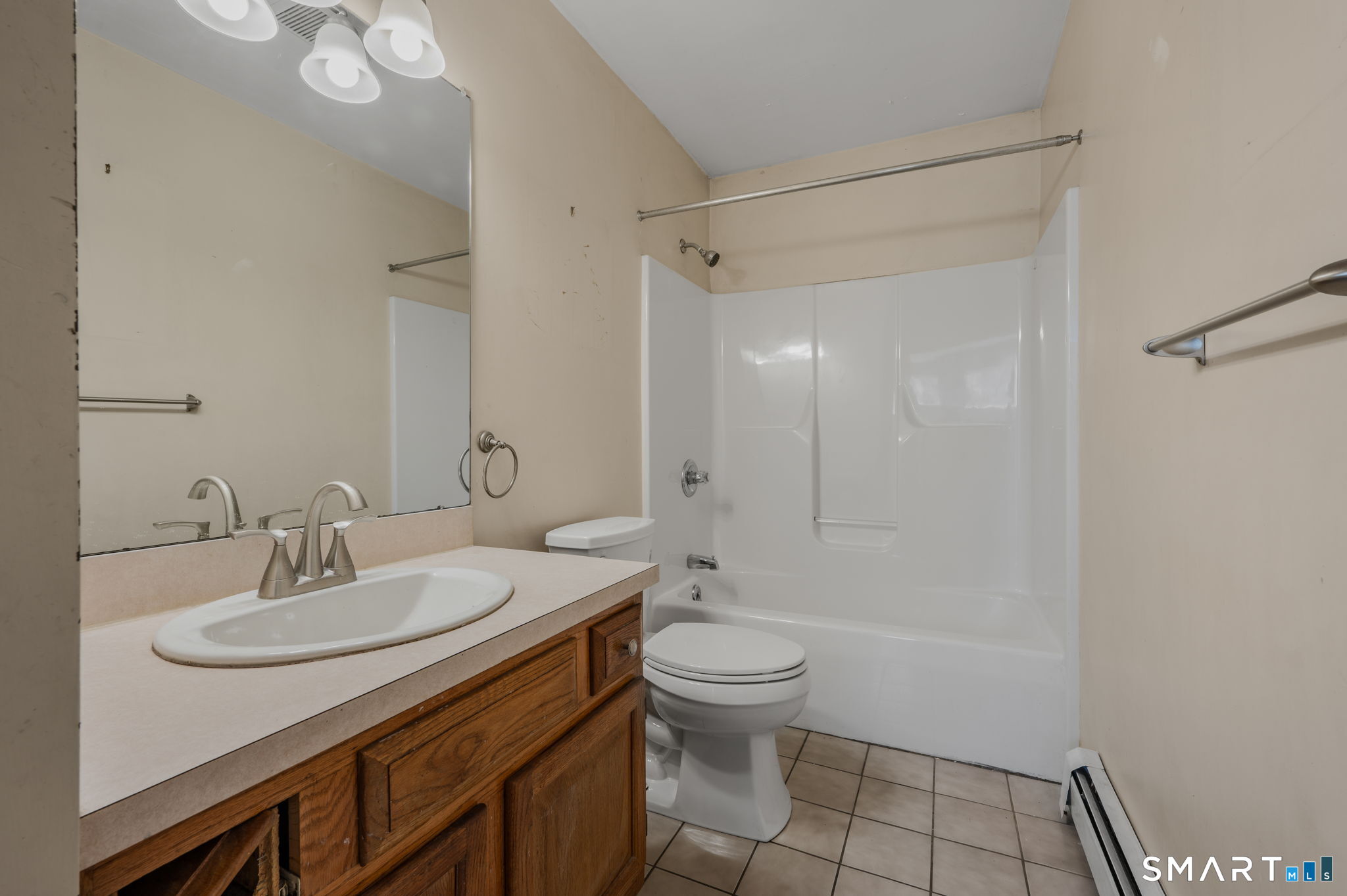 5 Windy Ridge Place, Unit 5 Waterford, CT 06385 - Photo 28 of 37 a bathroom with a sink toilet and shower