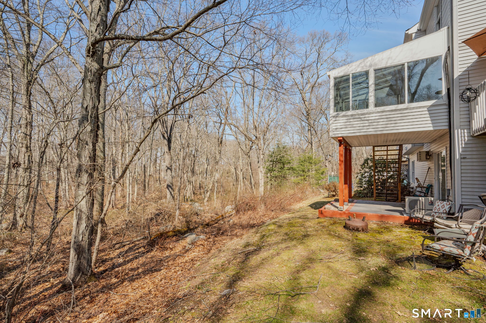 5 Windy Ridge Place, Unit 5 Waterford, CT 06385 - Photo 33 of 37 a view of backyard with wheel chair and wooden fence