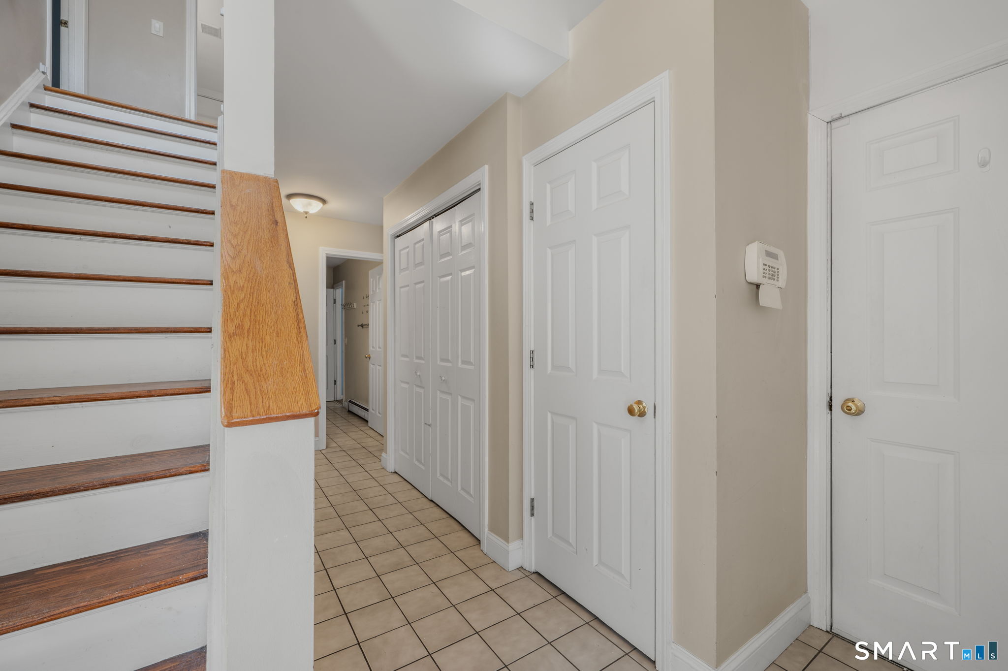 5 Windy Ridge Place, Unit 5 Waterford, CT 06385 - Photo 9 of 37 a view of a hallway with wooden floor and entryway