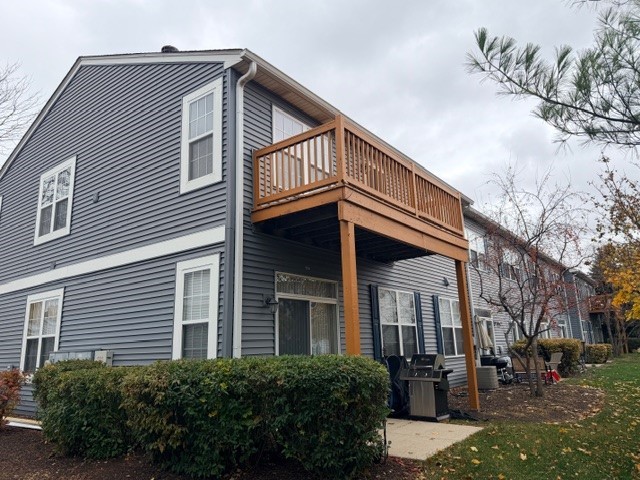 2418 Oneida Lane, Unit 2418 Naperville, IL 60563 - Photo 20 of 21 a front view of a house with a yard