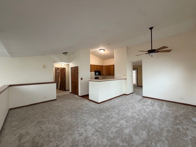 2418 Oneida Lane, Unit 2418 Naperville, IL 60563 - Photo 4 of 21 a view of a kitchen with a sink and a refrigerator