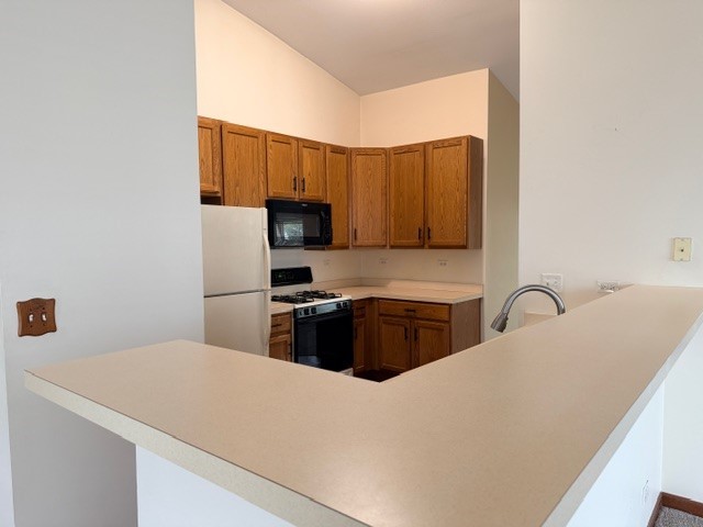 2418 Oneida Lane, Unit 2418 Naperville, IL 60563 - Photo 8 of 21 a kitchen with a refrigerator stove and sink