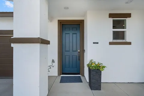 a view of entryway with flower pots