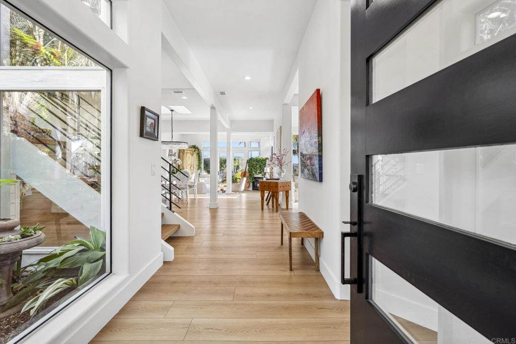 3443 Country Road Fallbrook, CA 92028 - Photo 2 of 71 a hallway with wooden floor and furniture