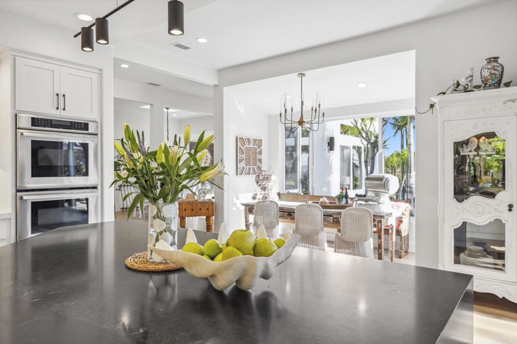 3443 Country Road Fallbrook, CA 92028 - Photo 23 of 71 a living room with fireplace furniture dining table and a potted plant