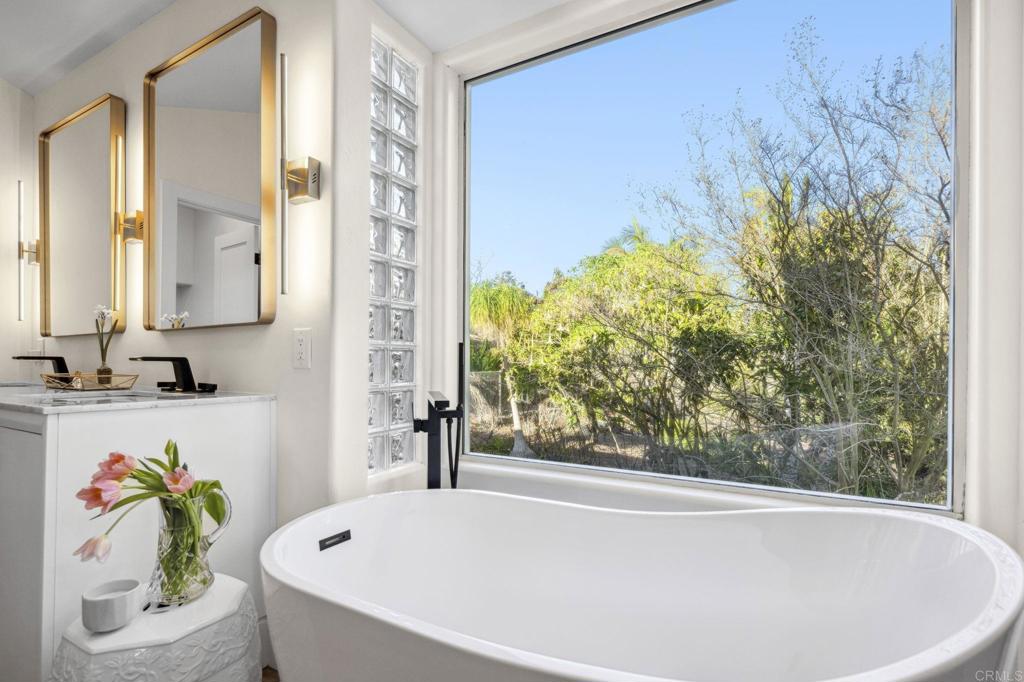 3443 Country Road Fallbrook, CA 92028 - Photo 29 of 71 a bathroom with a bathtub and a shower