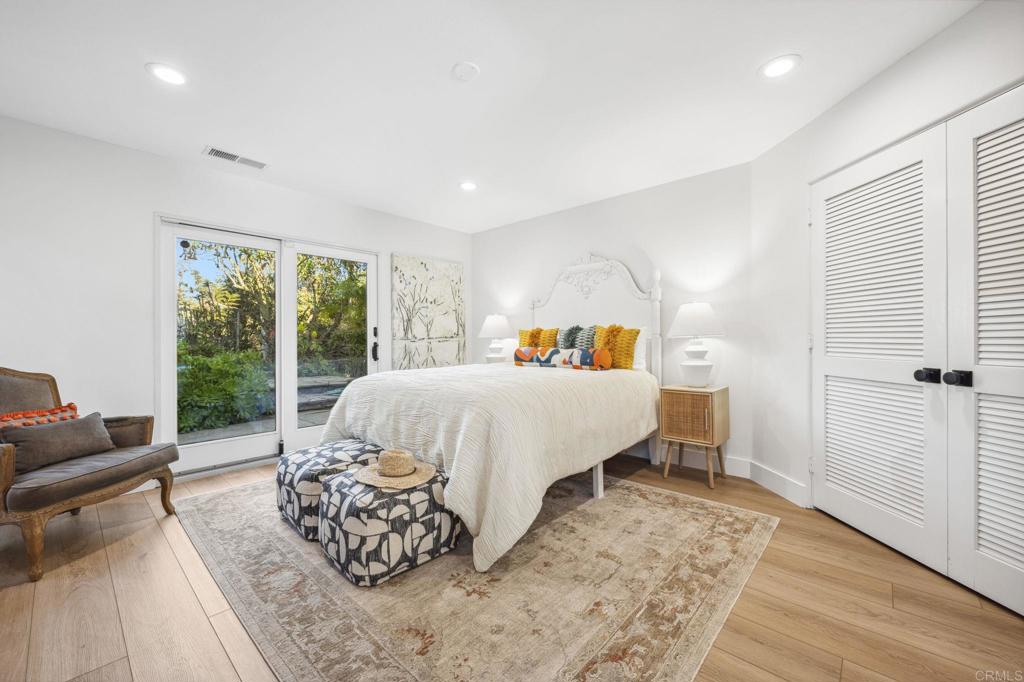 3443 Country Road Fallbrook, CA 92028 - Photo 37 of 71 a bedroom with a bed and wooden floor