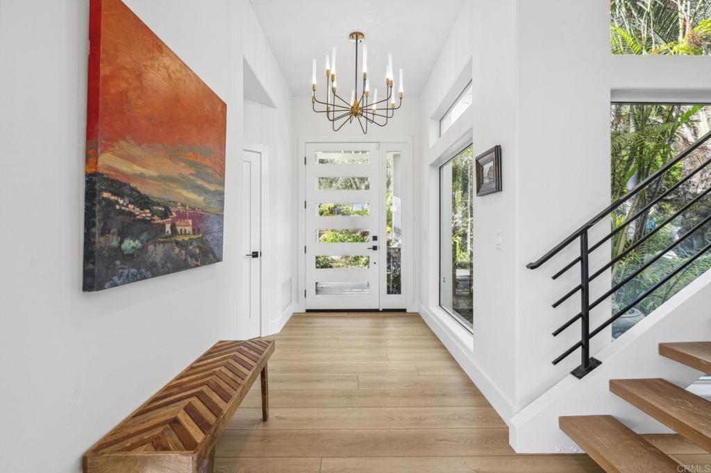 3443 Country Road Fallbrook, CA 92028 - Photo 4 of 71 a view of a hallway with wooden floor and staircase