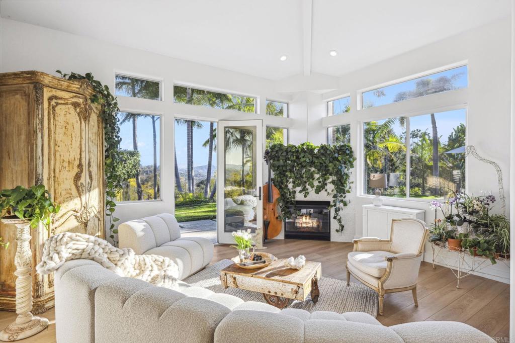 3443 Country Road Fallbrook, CA 92028 - Photo 6 of 71 a living room with furniture fireplace and potted plants